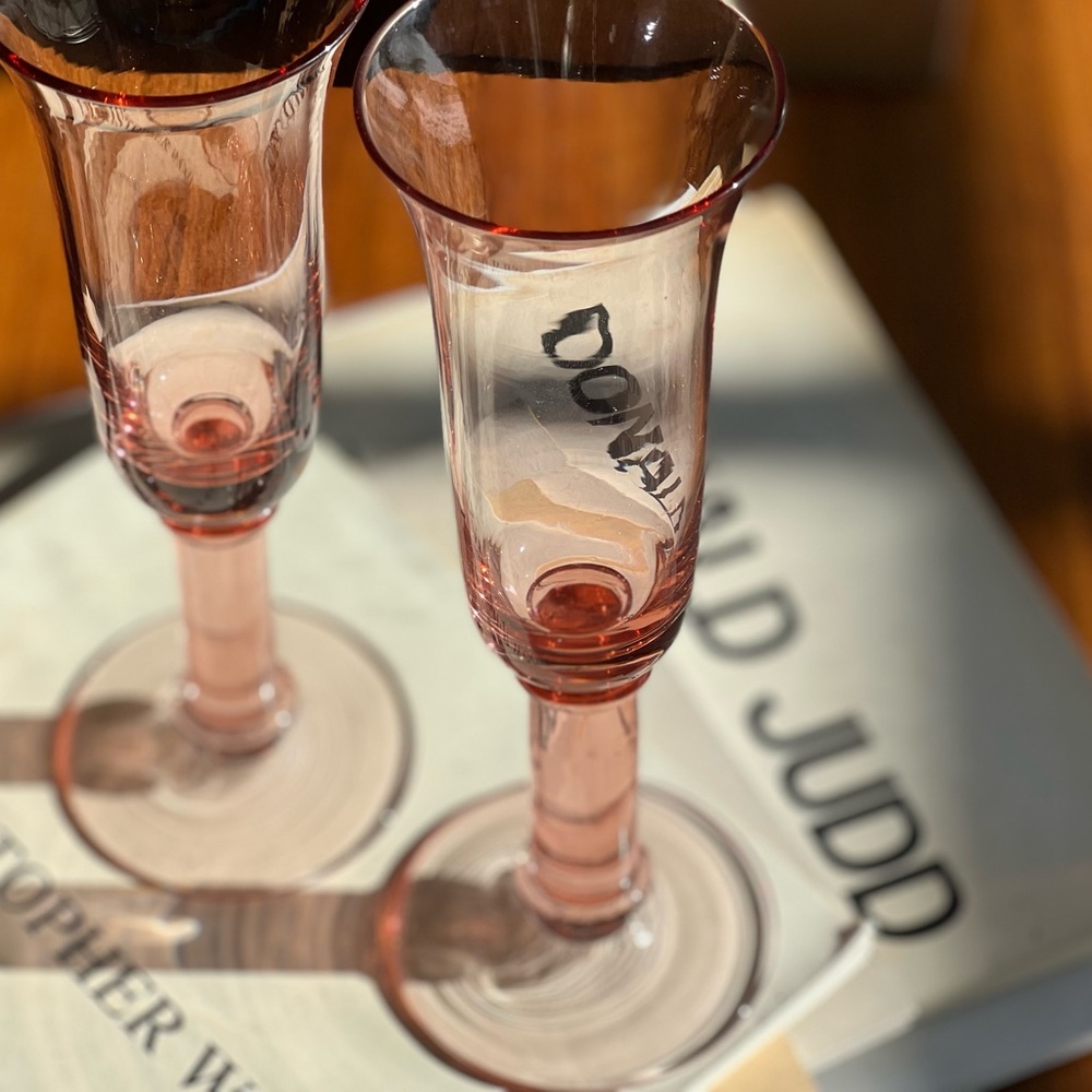 Pair of vintage pink glass champagne flutes wine glasses